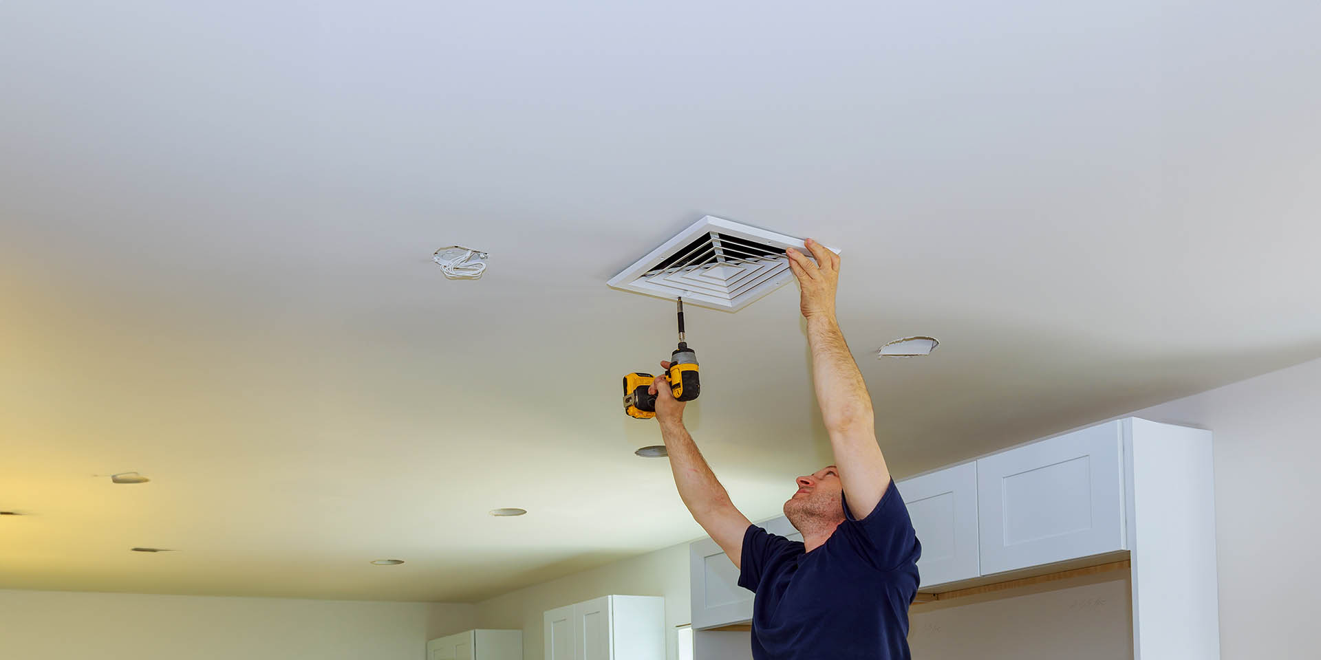 Skilled Technicians at Work Improving Ventilation